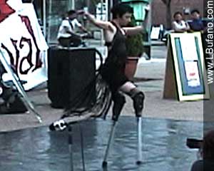 Lisa dancing in metal stilts fabricated by Jason Karakehian